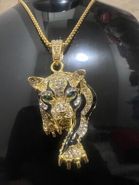 Gold-Tone Panther Pendant Necklace with Green Crystal Eyes